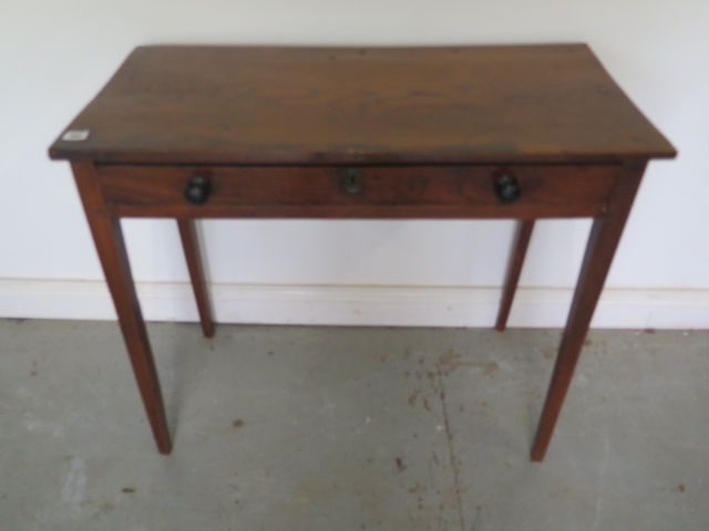 A Georgian elm side table with a single drawer on square tapering legs with good colour and patina -