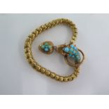 A yellow metal articulated serpent bracelet set with turquoise cabochons and diamond set eyes with a