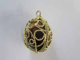 A Tigers eye stone egg in a gilt metal pendant cage mount - 45mm x 29mm - mount approx 15.8