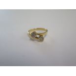 An 18ct yellow gold two stone diamond crossover ring size L - approx weight 3.6 grams - in good