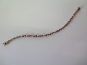 A 9ct yellow gold amethyst and diamond bracelet - Length 18cm - approx weight 6.5 grams - in good