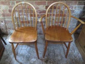 Two Ercol dining chairs including a carver