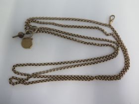 A 10ct yellow gold long belcher watch chain with a watch key and a masonic rotating fob - chain