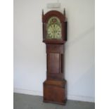 A mahogany 8 day striking longcase clock with a painted 13" moon roller dial signed N Gan