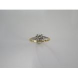 An 18ct yellow gold diamond solitaire ring size O - approx weight 2 grams - diamond bright and