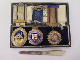 A Masonic silver jewel and two Buffalo silver jewels and a ribbon, Masonic jewel has damage to