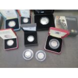 Eight silver proof coins - 3 x 50p, 3 x £1, 1 x £2 and a Churchill £5 - approx total weight 100