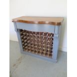 A shabby chic painted 48 bottle wine rack with a polished top and serpentine drawer - Height 92cm