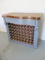 A shabby chic painted 48 bottle wine rack with a polished top and serpentine drawer - Height 92cm
