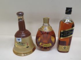 A 26 2/3 fl oz bottle of Dimple Whisky, a 75cl bottle of Bells blended Whisky and a 75cl bottle of