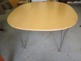 A Fritz Hansen table with chrome legs designed by Piet Hein and Bruno Mathsson made in Denmark