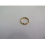 A hallmarked 9ct yellow gold band ring size J - approx weight 2.8 grams