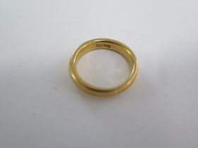 A 22ct yellow gold band ring size N - 4mm wide - approx weight 8 grams