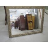 A modern gilt ornate wall mirror - 90cm x 116cm