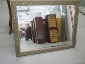 A modern gilt ornate wall mirror - 90cm x 116cm