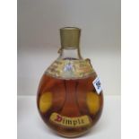 A bottle of John Haig and Co Ltd Dimple de luxe Scotch whiskey - level and seal good