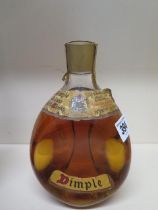 A bottle of John Haig and Co Ltd Dimple de luxe Scotch whiskey - level and seal good