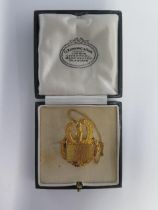 A 9ct yellow gold Masonic brooch with box - approx weight 9.6 grams