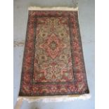 A fine woven silk mix rug with cream field and foliate design - 156cm x 95cm - some wear but