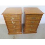 A pair of burr oak four drawer bedside chests each with a slide - made by a local craftsman to a