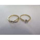 Two 9ct yellow gold diamond rings sizes J/L - approx weight 3 grams - good condition
