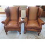 A pair of tan leather John Lewis Compton wing back armchairs - Height 107cm x 88cm wide - Original