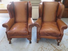 A pair of tan leather John Lewis Compton wing back armchairs - Height 107cm x 88cm wide - Original