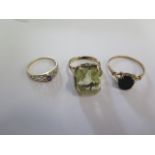 Two 9ct yellow gold rings sizes X and O and a gilt metal ring size N/O - tests to approx 9ct - total