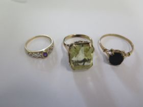 Two 9ct yellow gold rings sizes X and O and a gilt metal ring size N/O - tests to approx 9ct - total