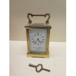A brass carriage clock - the dial signed Charles Frodsham London - overall 15cm - running, chips