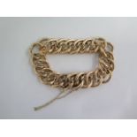 A 15ct yellow gold hollow link bracelet - approx weight 33.9 grams - some denting, wear and