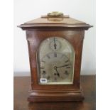 A bracket clock by Junghams with Westminster chimes - ticks but stops