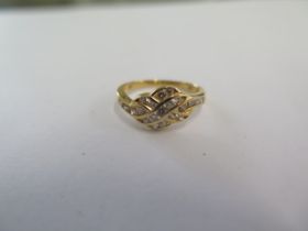 An 18ct yellow gold diamond ring size H/I - approx weight 2 grams - in good condition
