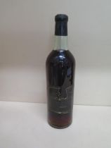 A bottle of Chateau Guiraud 1962 1st Cru Sauternes wine - level to base of neck, seal good