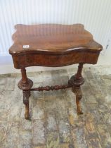 A Victorian burr walnut converted worktable/side table with a drawer above a slide - in good