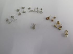 Five pairs of white and yellow gold earrings, an 18ct white gold pendant, a pair of gilt earrings