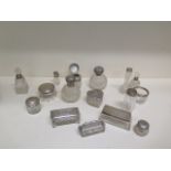 A good collection of 17 silver topped and rimmed dressing table tidies and bottles - weighable