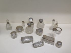 A good collection of 17 silver topped and rimmed dressing table tidies and bottles - weighable