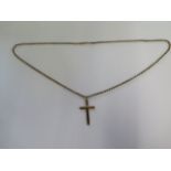 A 9ct yellow gold crucifix on a 9ct yellow gold 52cm chain - in good condition - total weight approx