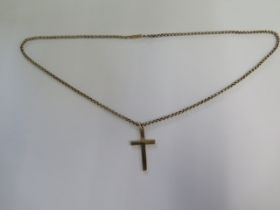 A 9ct yellow gold crucifix on a 9ct yellow gold 52cm chain - in good condition - total weight approx