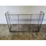 An early 1900's wire and brass fire screen - Height 69cm x 114cm x 30cm