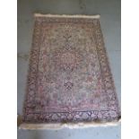 A fine woven silk mix rug with cream field and dark blue boarder - 192cm x 123cm - some slight