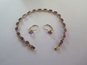 A 14ct yellow gold amethyst bracelet - Length 18cm - and a pair of 14ct yellow gold amethyst