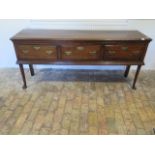 A Georgian style oak three drawer dresser on shaped front legs - Height 84cm x 187cmk x 46cm - in