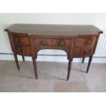 A Georgian mahogany and inlaid sideboard with five drawers on turned legs measuring 160cm wide x