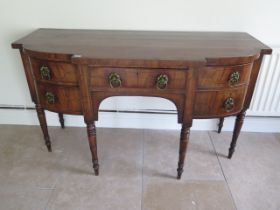 A Georgian mahogany and inlaid sideboard with five drawers on turned legs measuring 160cm wide x