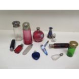 A collection of 14 scent and other bottles - some with silver tops