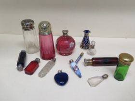 A collection of 14 scent and other bottles - some with silver tops