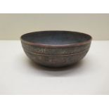A Persian copper bowl with traces of silver plating - 5cm x 15cm