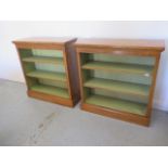 A pair of burr oak open bookcases with adjustable shelves and painted interior - made by a local